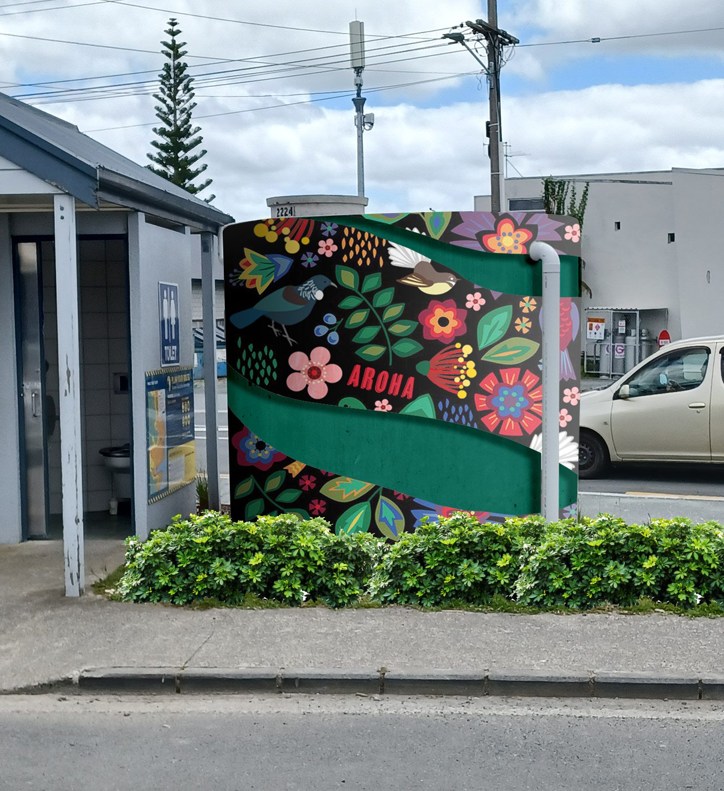 Water tank with images of flowers, fern and a tui bird.